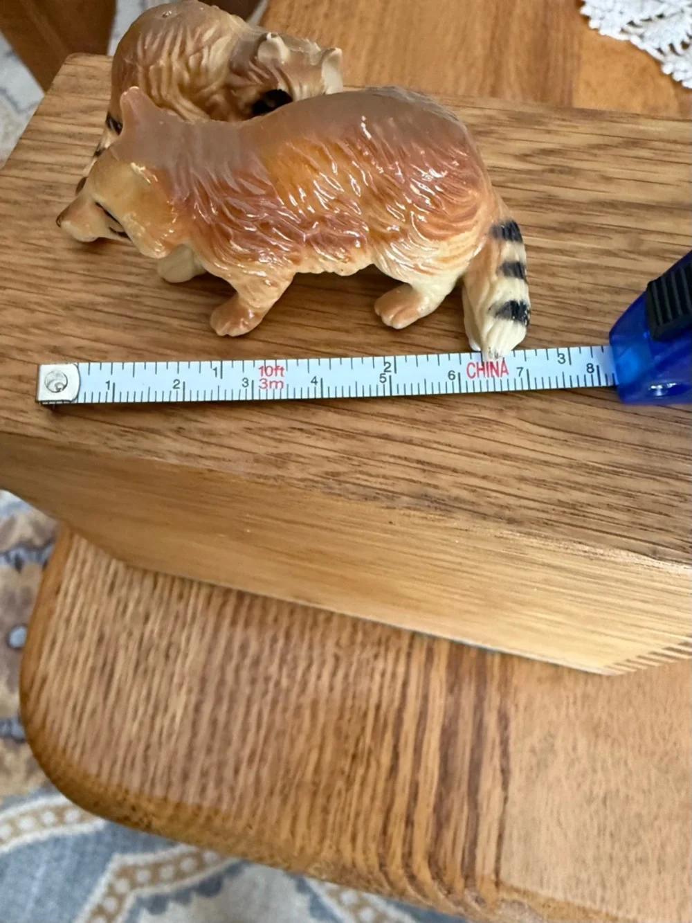 Mini pair of raccoon figurines